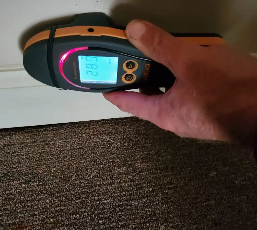 Moisture detection at baseboard during Sewage Cleanup & Sanitation in Manhattan